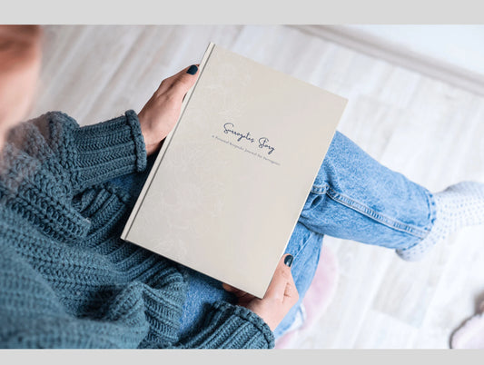 Person holding the journal surrogates story